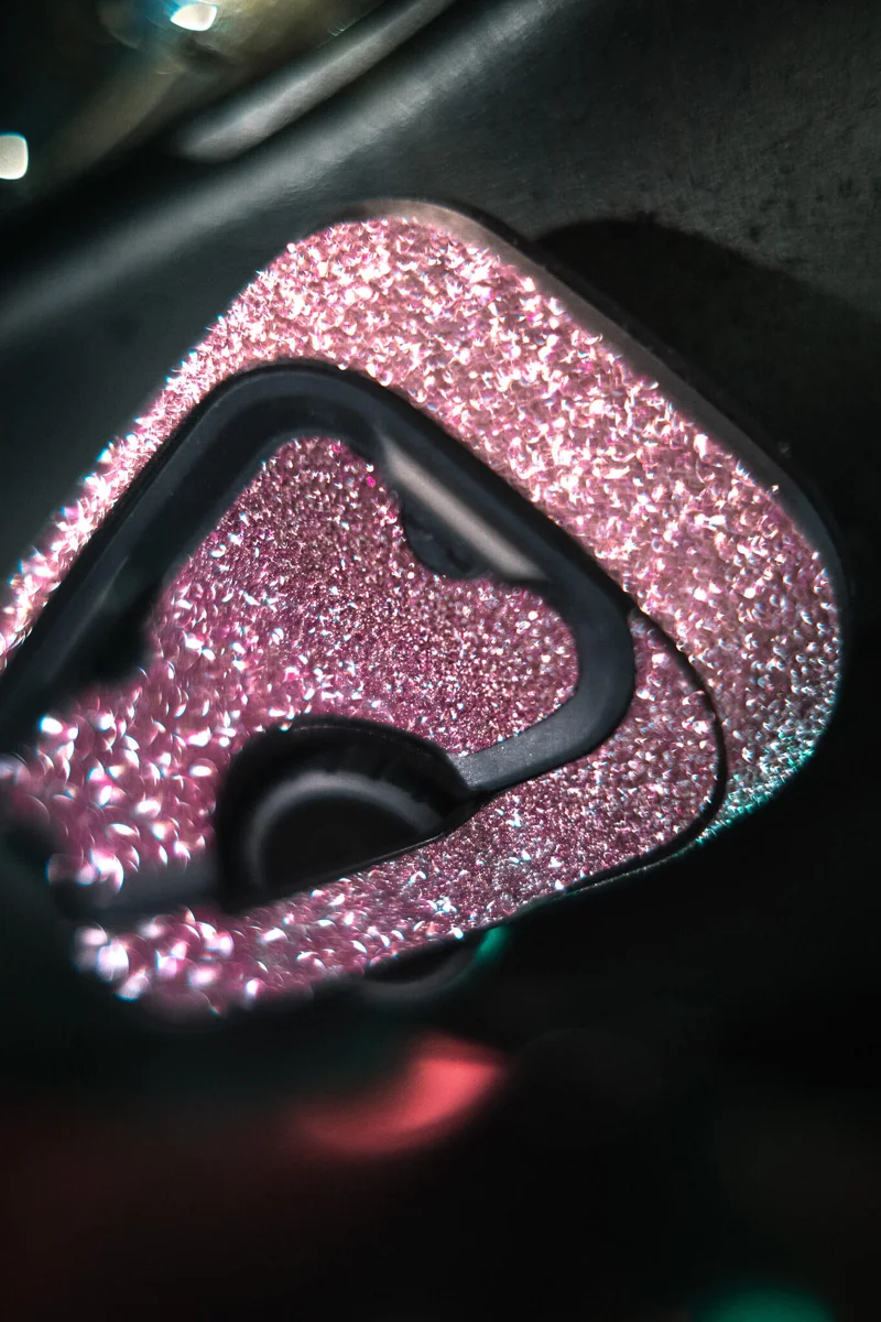 Pink diamond sparkle skin on a Cardo motorcycle intercom